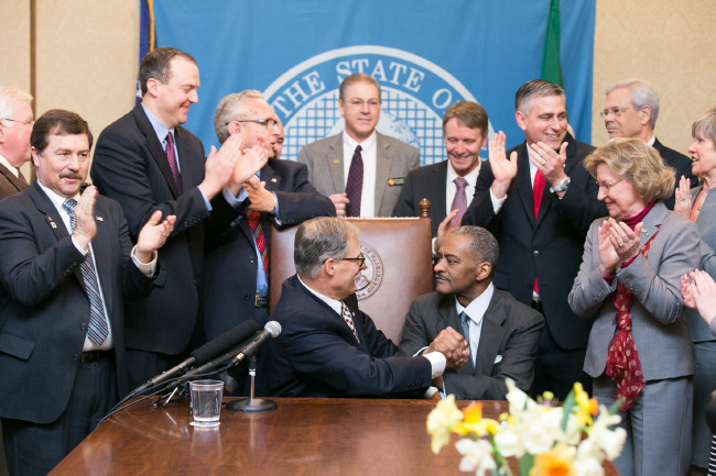 Gov. Jay Inslee signs Substitute House Bill No. 1559, April 1, 2015. Relating to higher education programs at Washington State University and the University of Washington.