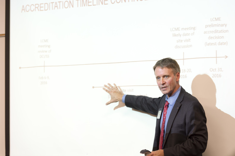 Vice Dean Ken Roberts shows the timeline for WSU's medical school accreditation at a public meeting in Everett in October 2015.