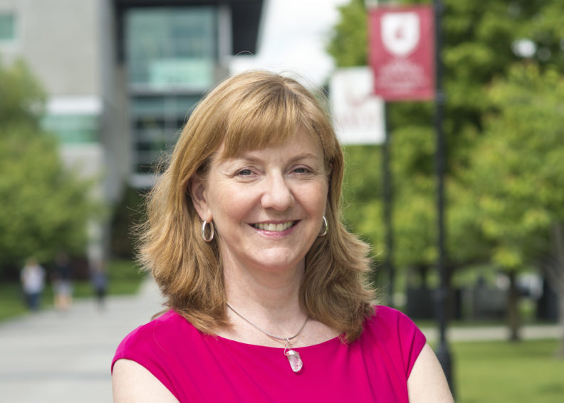 Photo of new ESFCOM Vice Dean for Student and Faculty Experiences Dawn DeWitt, pictured outside on the campus of WSU Spokane.